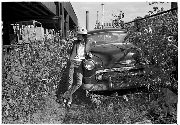 Judy Linn, Patti, car and sunflowers, early 1970s jlf7030